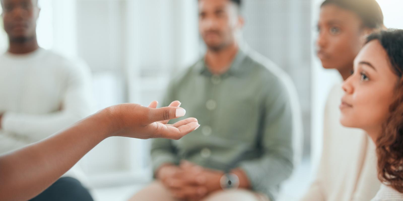 Talking hands and group of people in therapy - by Yuri Arcurs - Most Photos